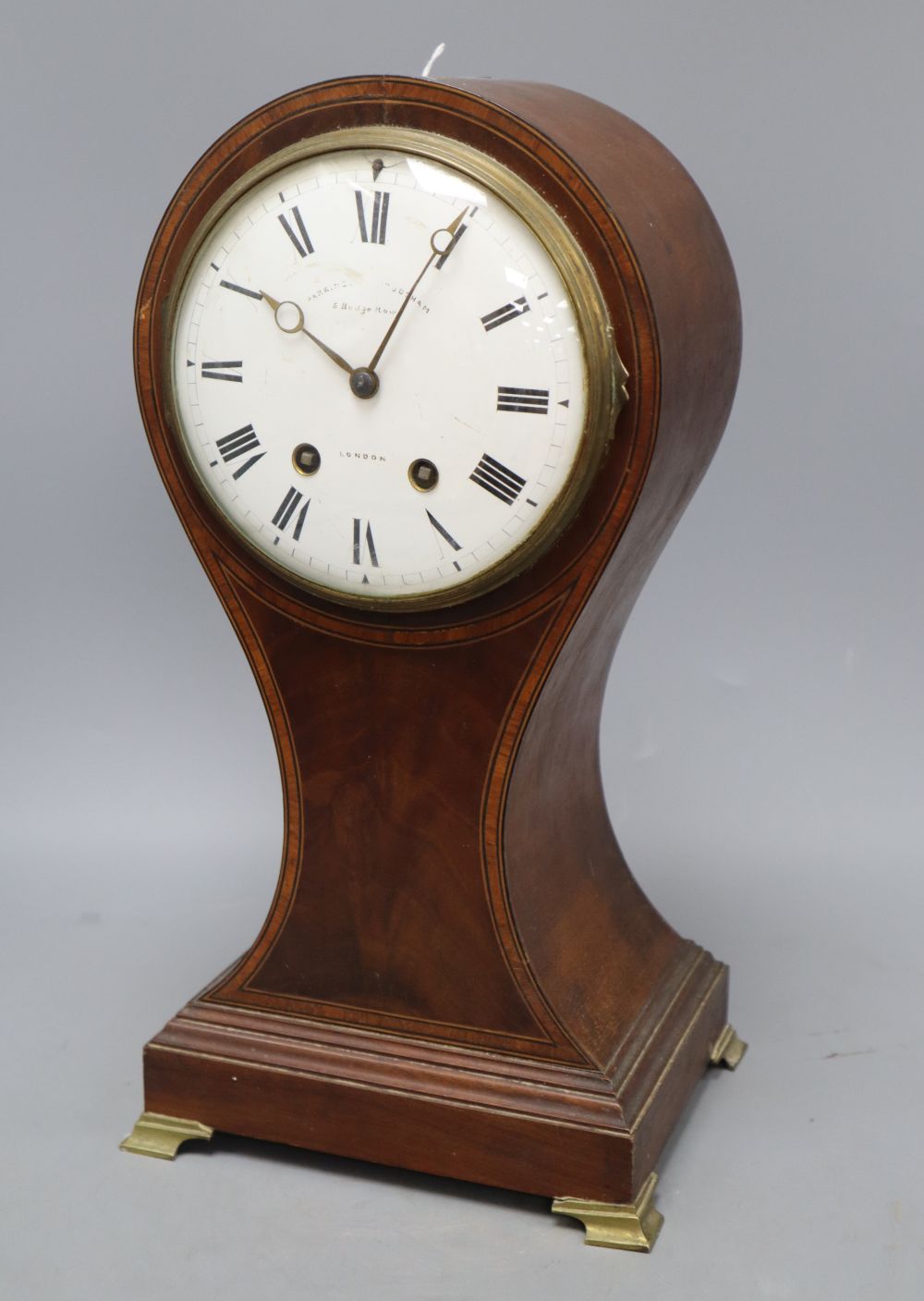 A mahogany balloon cased clock, with French movement, height 40cm